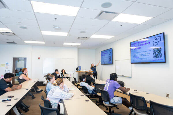 FYS Mentor Hailey Beaufort presents about the CCE to her class.